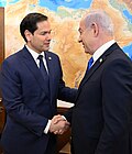 Benjamin Netanyahu (right) shakes hands with American politician Marco Rubio (left).