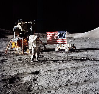 The first image is a successful moon landing in full color containing the American flag, an astronaut, a lunar rover, and a lunar landing module. The second image is an emblem containing a statue of the Greek god Apollo, red stripes inside an eagle made of white lines, the Moon, Saturn, and a spiral galaxy; along the outside of the emblem are is the word "Apollo" along with the number "seventeen" in roman numerals, and then the name "Cernan", "Evans", and "Schmitt". The third and final image contains Schmitt on the left, Cernan in the middle and sitting, and Evans behind Cernan.
