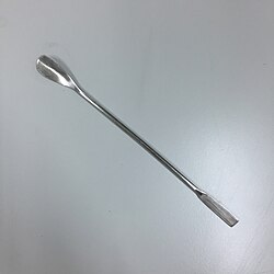 A stainless steel laboratory spatula